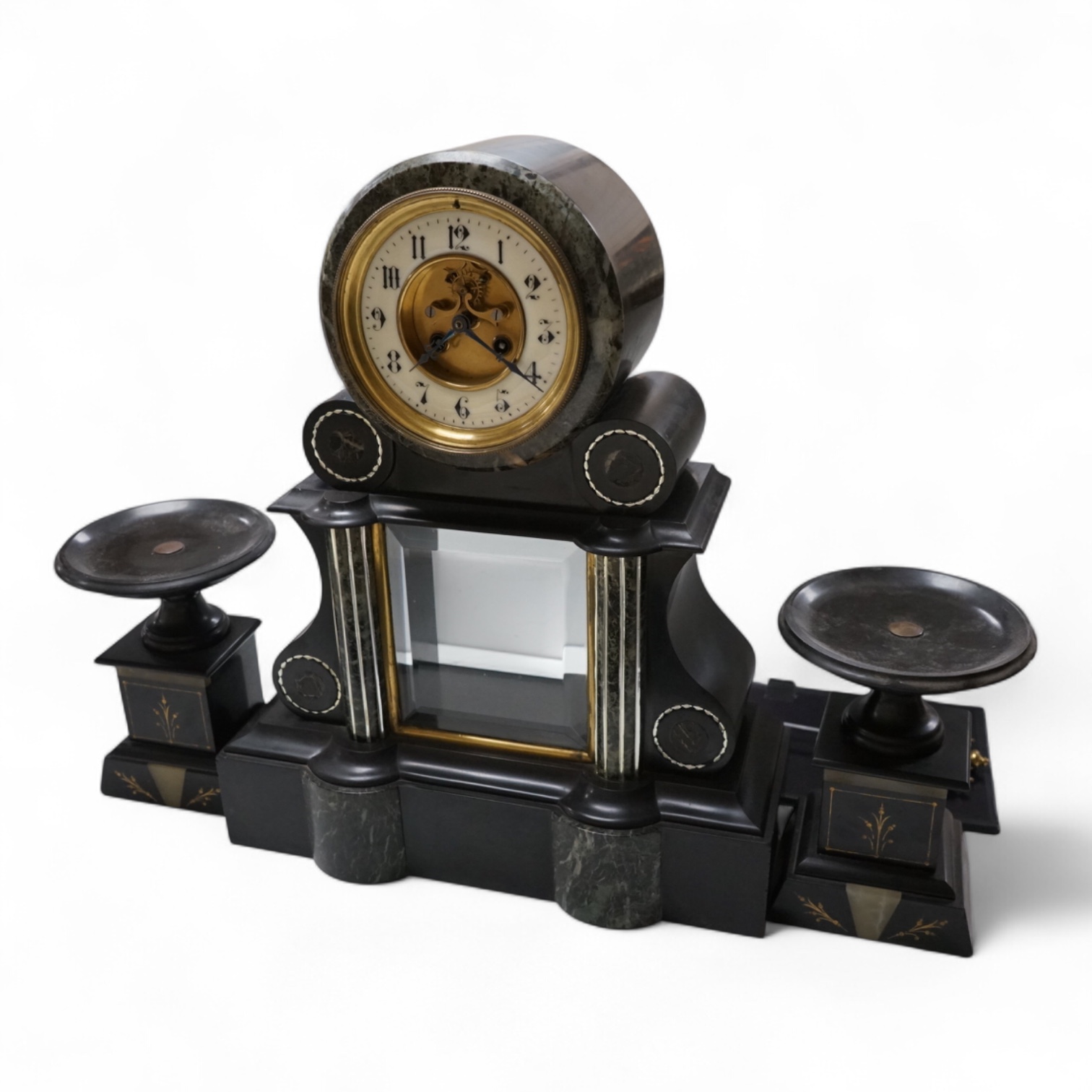 A Victorian slate clock garniture with enamelled chapter ring and mercury pendulum, 47cm high